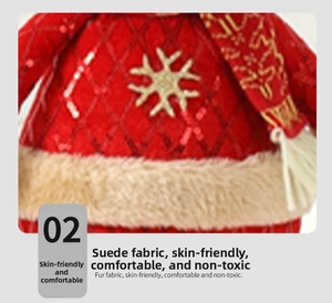 Detail of red sequin fabric and white embroidered snowflakes on Christmas figurine