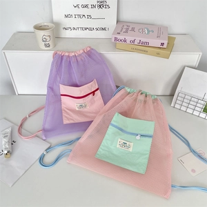 Detail of drawstring mesh backpack with colorful water-resistant front zipper pocket