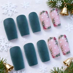 Christmas press-on nails with matte green finish and holly berry patterns on white background