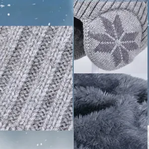 Winter thermal knit hat with ear flaps, grey snowflake pattern and thick fleece lining