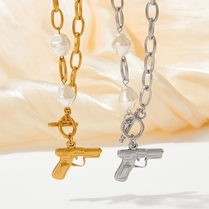 Elegant OT buckle pearl necklace with pistol pendant in gold and silver finish