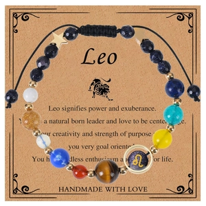 Detail of Leo zodiac braided bracelet with natural stone beads and gold star charms