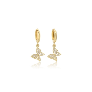 Close-up of golden butterfly earrings with sparkling cubic zirconia in hollow design