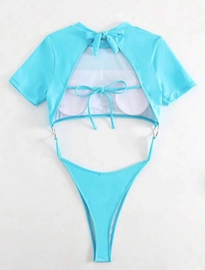 Detail view of mint blue cutout swimsuit featuring short sleeves and metal ring connectors