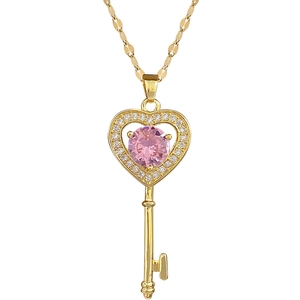Luxurious heart key pendant necklace in gold with pink gemstone and crystal halo