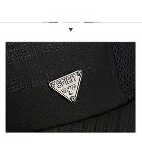 Detail display of black mesh baseball cap featuring silver metallic Spirit eagle badge