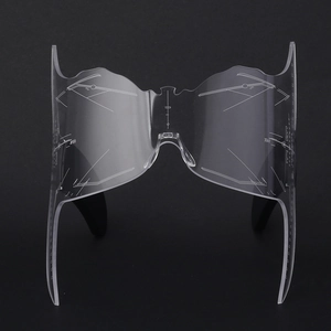 Macro view of transparent acrylic butterfly makeup stencil with precision etched scale lines