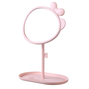 Pink desktop makeup mirror with cute cat ears and storage base on white background