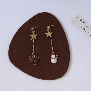 Asymmetric Christmas drop earrings featuring a gold reindeer and snowman with sparkling stars