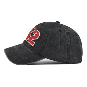 Washed black cotton baseball cap featuring red and white D2 letter embroidery