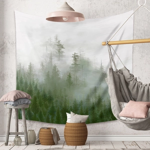 Detail of bohemian forest tapestry hanging in a cozy living room with nordic decor