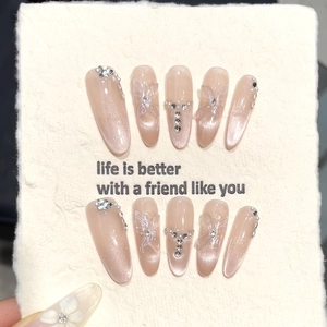 Cat eye press-on nails with 3D butterflies and rhinestones in long almond shape