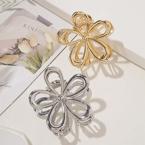 Pinces à cheveux fleurs évidées chic en métal doré et argenté pour femmes