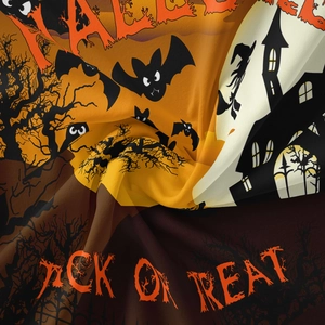 Detail of Halloween tapestry fabric featuring bat motifs and spooky castle silhouette