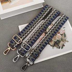 Adjustable woven crossbody bag straps with metal hooks in gold, silver, and gunmetal finishes