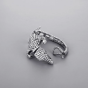 Detailed close-up of retro silver crocodile bracelet featuring intricate scale texture