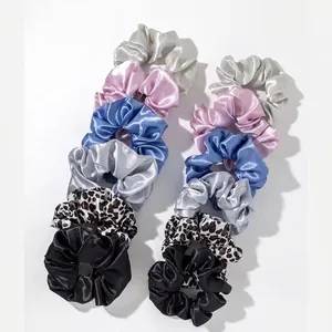 Set of 12 satin hair scrunchies in solid colors and leopard print patterns