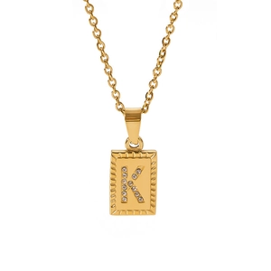 Macro detail of 18k gold plated rectangular pendant with zircon inlaid letter K