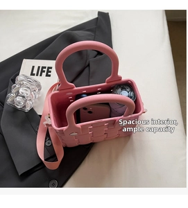 Internal view of pink EVA mini tote showing storage space for phone and umbrella