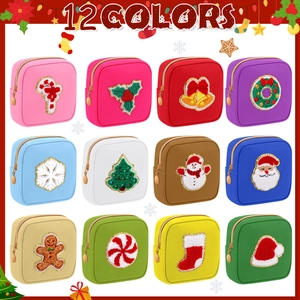 Set of 12 colorful Christmas patches mini makeup bags with golden zippers and festive patterns
