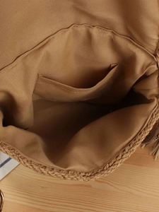 Internal view of handmade woven straw crossbody bag with khaki fabric lining and pocket