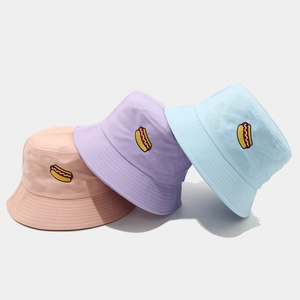 Pastel cotton bucket hats with hot dog embroidery in pink, purple, and blue colors