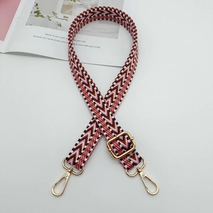 Adjustable woven shoulder strap with colorful zigzag pattern and gold hardware hooks