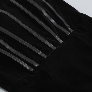 Close-up of velvet texture and vertical leather corset boning on black party dress