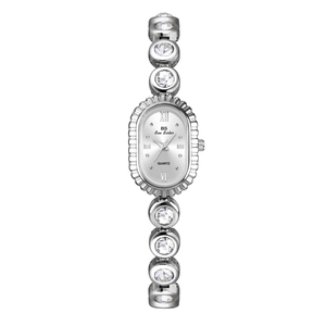 Close-up of a silver oval quartz watch with crystal-encrusted metal link bracelet