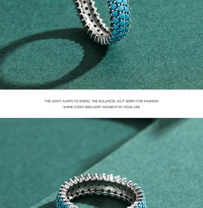 Macro detail of retro S925 silver ring featuring turquoise beads and wavy patterns