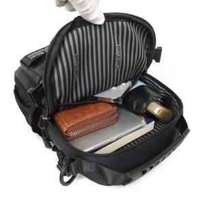 Men's black crossbody chest bag featuring multi-layer storage and striped interior lining