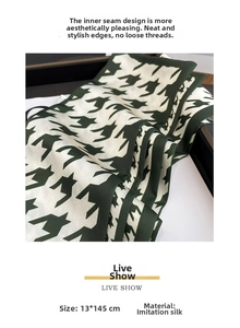 Detail of dark green houndstooth silk scarf measuring 13x145cm with internal seam edges