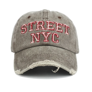 Detail of distressed brim and 3D STREET NYC embroidery on washed cotton baseball cap