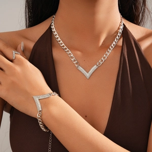 Three-piece silver chain jewelry set featuring V-shaped rhinestone necklace and bracelet