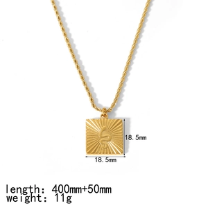 Detailed view of 18K gold plated sunburst pendant with size and weight specifications