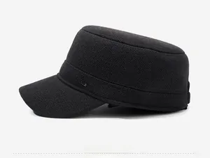 Detail view of winter cadet cap featuring a Sports Style metal logo on thick textured fabric
