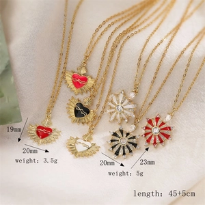 Detail of zircon-inlaid heart necklaces with size specifications and weight data