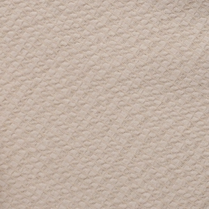 Close-up of beige textured fabric featuring intricate embossed 3D flower dress patterns