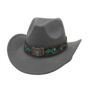 Detailed view of grey wool felt cowboy hat featuring leather band with turquoise embroidery