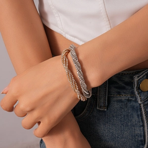 Luxury multi-layer rhinestone wrap bracelets in gold and silver finish on a female model