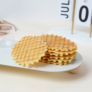 Realistic artificial waffle biscuit prop on a white tray for window display decor