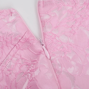 Detail of pink jacquard dress showing high quality invisible zipper and floral embroidery