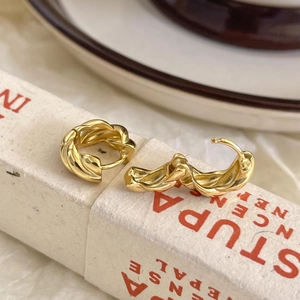 Minimalist golden twisted rope hoop earrings made of 925 sterling silver for women