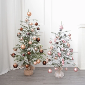 Champagne gold and pink flocked Christmas tree with ornaments and linen base for decor