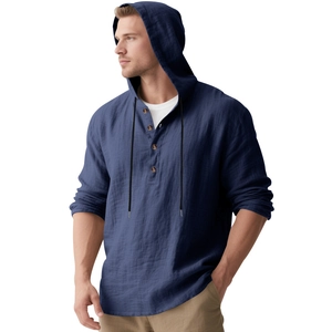 Detail of navy linen hoodie shirt featuring a four-button placket and drawstring hood