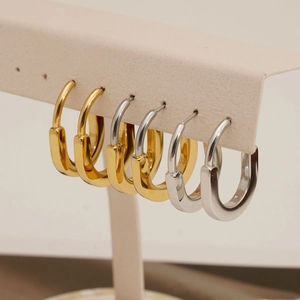 Minimalist U-shaped stainless steel earrings in gold and silver finish, sleek geometric style