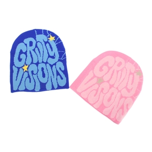 Blue and pink knit beanies with gravity visions graffiti jacquard and star patterns