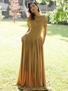 Elegant off-shoulder mustard yellow pleated long dress with a slim-fit waist design