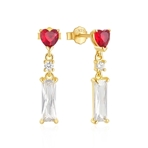 Macro shot of 925 silver heart earring with red gemstone and cubic zirconia details