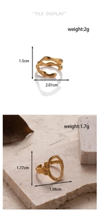 Detail of adjustable gold wave and hammered oval rings showing precise size and weight stats